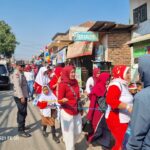 Bhabin Ciluncat Polsek Cangkuang, Kawal Pawai HUT RI Ke-79 Murid SDI Insan Kamil Ciluncat