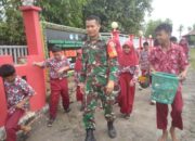 Babinsa dan Siswa SDN 3 Carawali Kompak Wujudkan Lingkungan Bersih