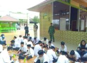 Babinsa Dampingi Penyaluran Gizi Gratis untuk Ratusan Siswa